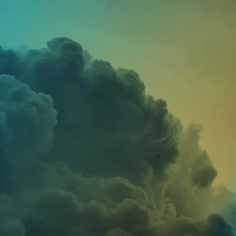 Fluffy white clouds with a blue to yellow gradient overlay