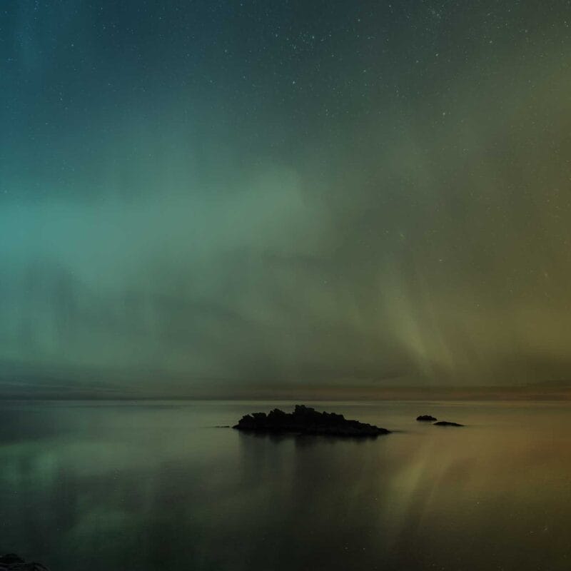Aurora borealis lights over a lake