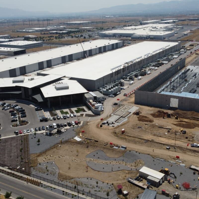 an arial shot of data center buildings in different phases of construction.
